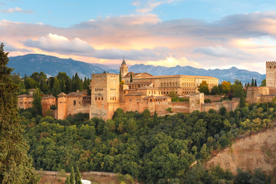 Palace and fortress complex Alhambra with Comares Tower, Palacios Nazaries and Palace of Charles V during sunset in Granada, Andalusia, Spain