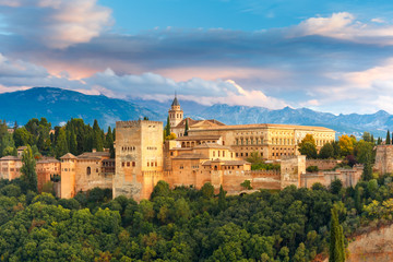 Palace and fortress complex Alhambra with Comares Tower, Palacios Nazaries and Palace of Charles V during sunset in Granada, Andalusia, Spain - obrazy, fototapety, plakaty
