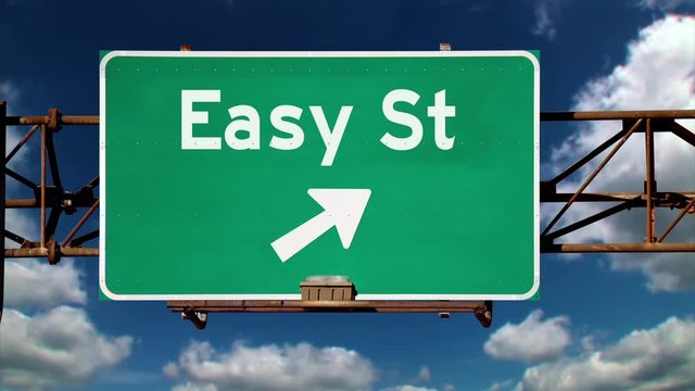 A road sign pointing to the direction of Easy Street.  	