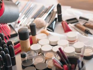 Obraz premium Various cosmetics and makeup stuff on the table, backstage