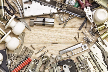 Tools and mortise lock arranged in a frame.