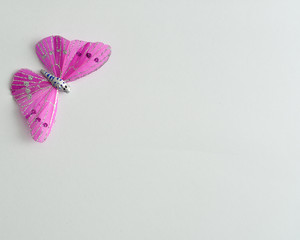 A purple silk butterfly used for decoration isolated on  white