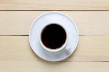 Top view black coffee on wood table.
