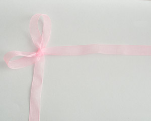 A silky ribbon that is tied into a bow 
