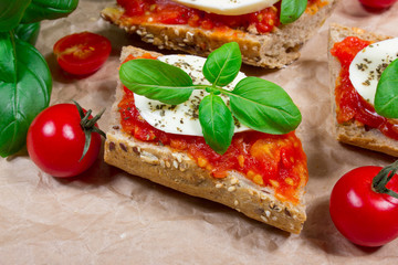 Italian bruschetta with cherry tomatoes, mozzarella & fresh basil.