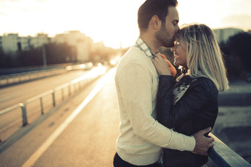 Romantic couple in love enjoying sunset