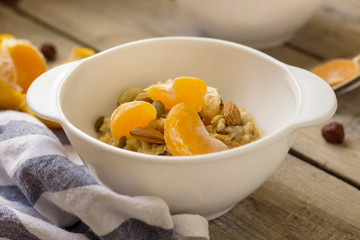 Oatmeal with tangerine and walnuts
