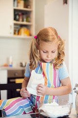 Cute little girl preparing Christmas sweets