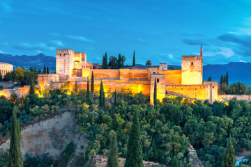 Fototapeta na wymiar Moorish fortress Alcazaba, citadel of Alhambra, during evening blue hour in Granada, Andalusia, Spain