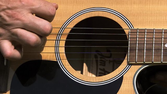Man playing acoustic Guitar, Slow motion