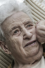 Closeup portrait of thoughtful senior woman