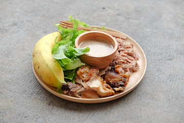 Healthy salad on wooden plate