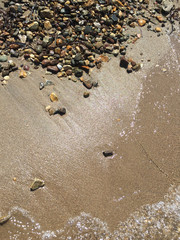 Pebbles on a sandy beach