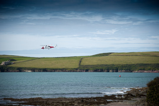 Helicopter of the Coast Guard exercises near Daymer Bay in north Cornwall.