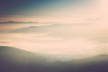 Foggy mountains at sunrise.