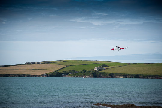 Helicopter of the Coast Guard exercises near Daymer Bay in north Cornwall.