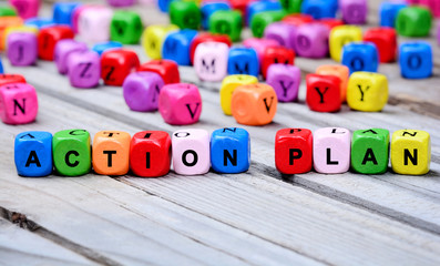 The colorful words Action Plan on table