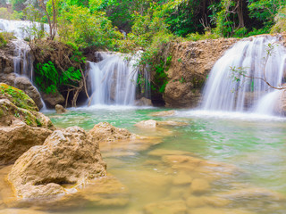 Fototapeta na wymiar Deep forest waterfall at Namtok thi Lo Su waterfall National Park ,Umphang , Tak Province Thailand