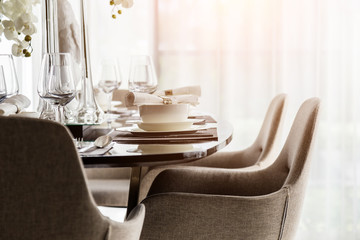 closed up nice dining chair with wooden table and dish sets inte