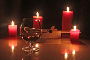 christmas composition photo cognac glass and candle on black background