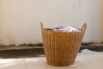 Clothes in a laundry wooden basket