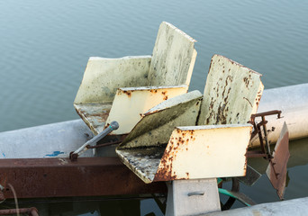 Fototapeta na wymiar Abandoned pedalo cycle boat in lake