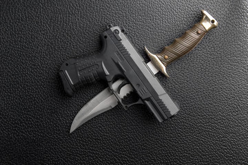 Pistol and knife background