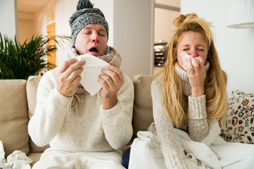 Sick couple catch cold. Man and woman sneezing, coughing, got flu, having runny nose. - obrazy, fototapety, plakaty