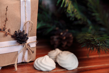 Christmas background on wood.  gift and marshmallows
