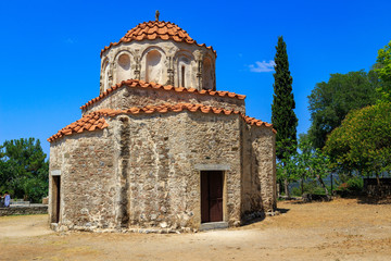 Fototapeta na wymiar Ancient church Agios Nikolaos Fountoukli on Rhodes island originally formed part of a late Byzantine monastery. It is famous for its 14-century frescoes and a dome sitting on a stone drum.