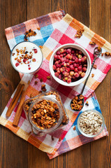 Homemade granola with wild strawberries and yogurt