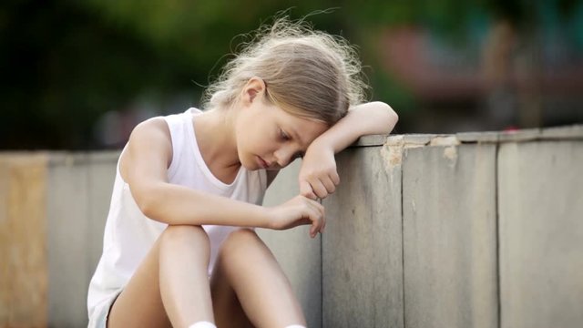 
portrait of sad girl being alone and worried outdoors