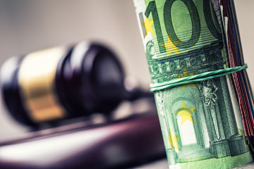 Judge's hammer gavel. Justice and euro money. Euro currency. Court gavel and rolled Euro banknotes....