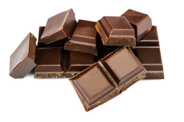 Dark chocolate cubes isolated on white background.
