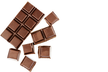 Dark chocolate bar and cubes isolated on white background, top view.