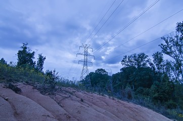 high voltage carrier power lines through the forest