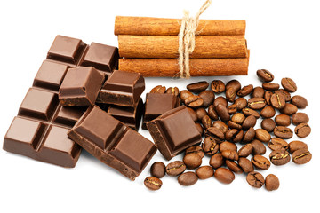 Dark chocolate bar, cubes, cinnamon sticks and coffee beans isolated on white background.