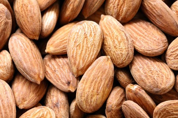 close-up background dry almond seeds, texture