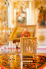 Fototapeta na wymiar Golden religious utensils. Details in the Orthodox Christian Church. Russia.