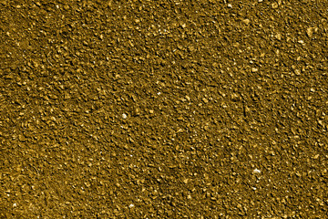Gold earth and gravel macro texture background