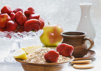 Fruit still life with apples and strawberry porridge.