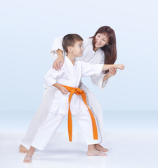 Mother and son are training karate kick © andreyfire