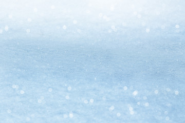 Winter background. Sparkling snow with bokeh
