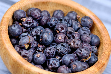 Juniper in a bamboo bowl on table