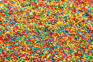 Colorful sprinkle dots in white plate