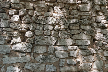 The old wall of stones and clay