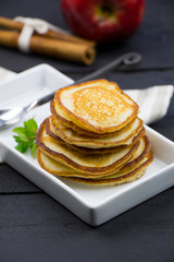 Apple pancakes with cinnamon. Homemade pancakes.