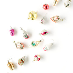 creative arrangement of bright christmas balls and toys on white background. flat lay, top view
