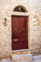 Typical maltese door with knockers in Mdina