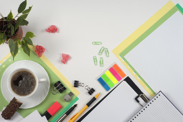 Business blank, notepad, coffee cup and pen at office desk table top view. Corporate stationery branding mock-up